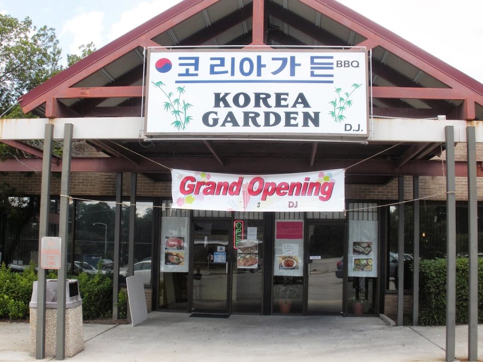 Simple dining room with Korean restaurant seating.