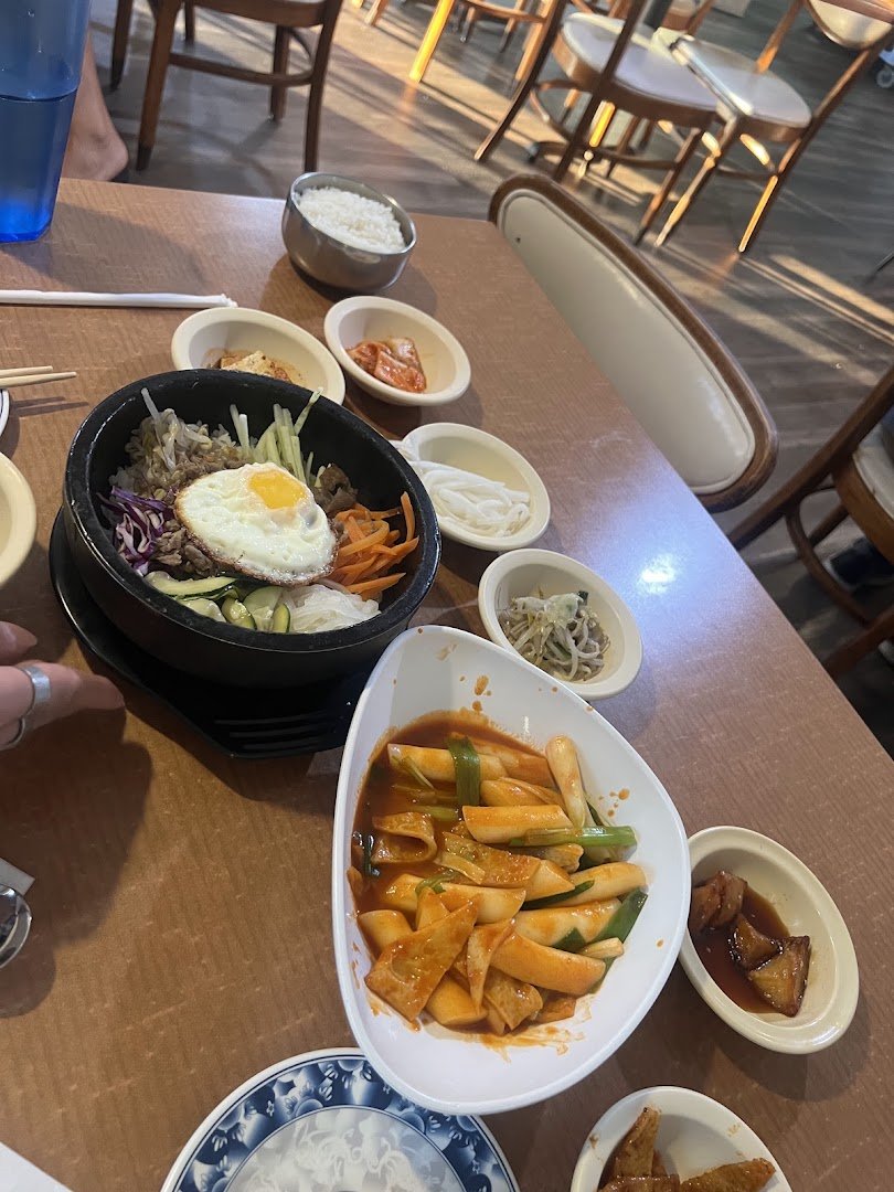 Simple dining room with Korean restaurant seating.