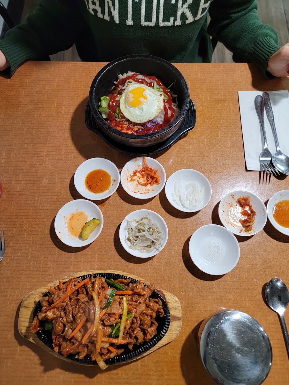 Printed menu showing noodles and stew dishes.